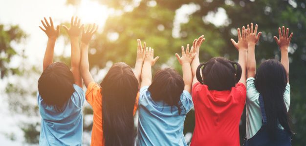 group-of-kids-friends-arm-around-sitting-together_1150-3907